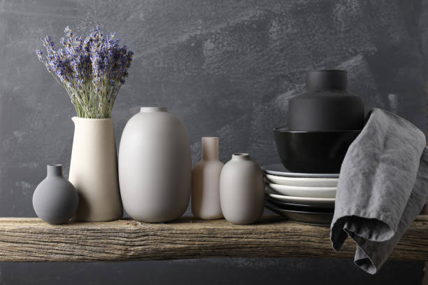 istock Neutral colored crockery on wooden shelf 871497066