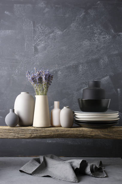 istock Neutral colored crockery on wooden shelf 871497074