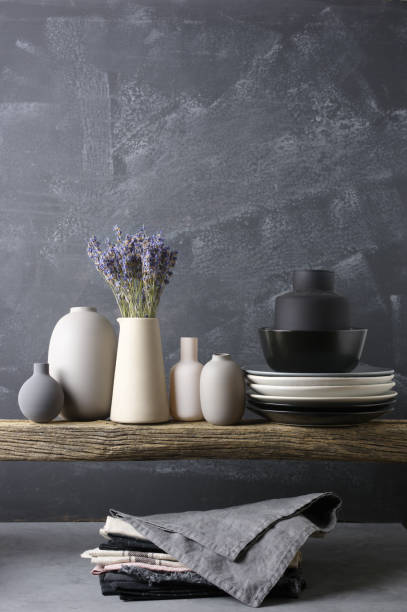 istock Neutral colored crockery on wooden shelf 871497082