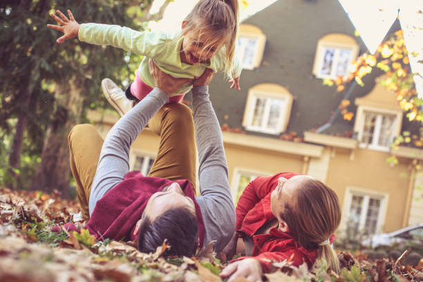 istock Parents have play with child outside. 871497096
