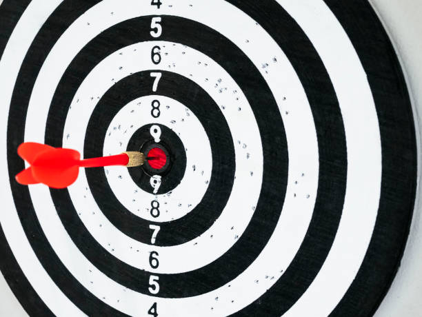 istock Dart board with red arrow hit center Target Goal concept 871498296