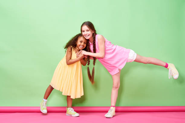 istock Happy multiethnic girls playing together 871498846