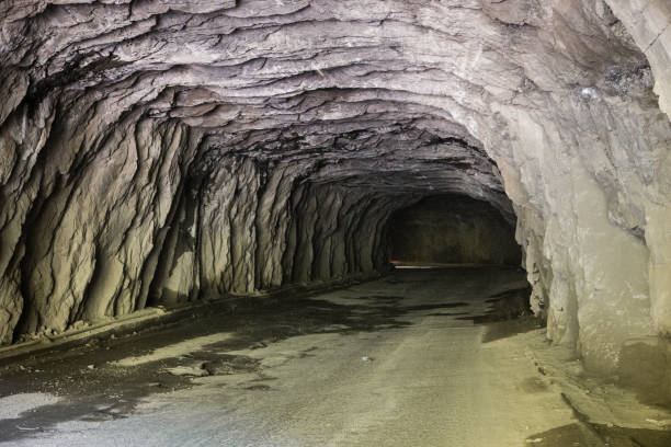 istock road tunnel made in the rock unfinished rough surface 871499006