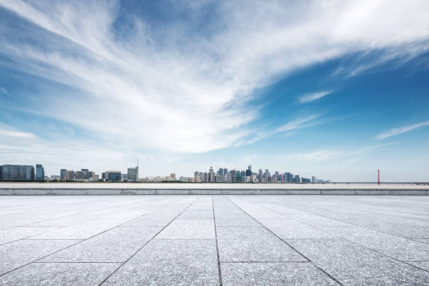 istock empty marble floor with modern bridge and buildings 871502436