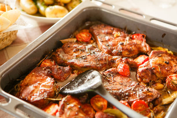 istock Baked meat with tomatoes and potatoes 871505258