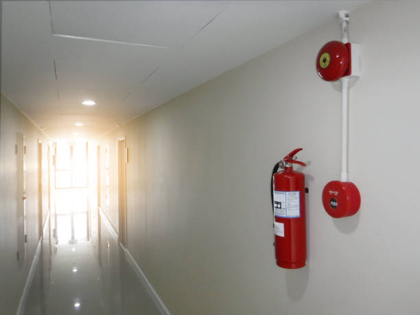 istock Fire extinguisher with fire alarm at corridor 871508824