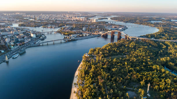 Aerial top view of Kyiv skyline, Dnieper river and Truchaniv island from above, sunset in Kiev city, Ukraine Aerial top view of Kyiv skyline, Dnieper river and Truchaniv island from above, sunset in Kiev city, Ukraine dnieper river stock pictures, royalty-free photos & images