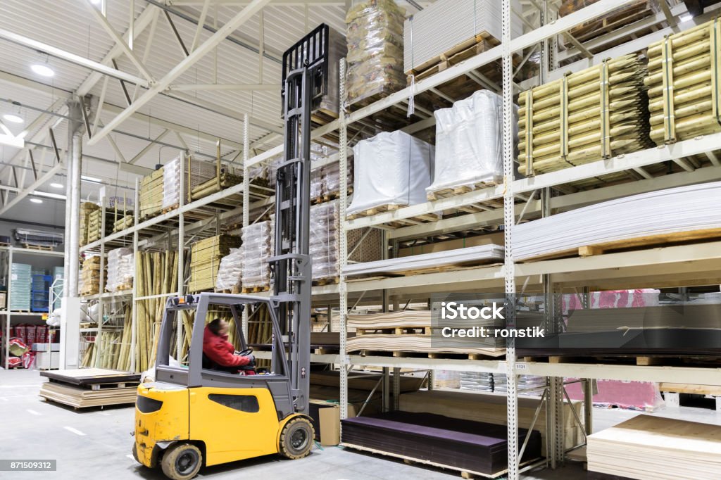 Warehouse Using Loading Tools Warehouse Worker Loading Construction Materials With Forklift Stock ...