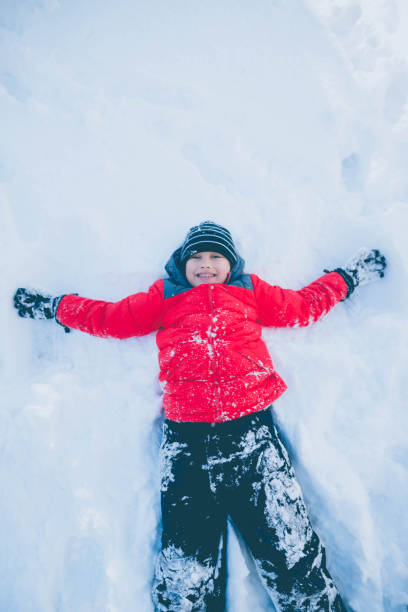 istock Little Boy Angel in Snow 871509424