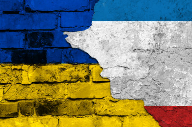 istock Flags of Ukraine and Crimea on a textured brick wall 871510190