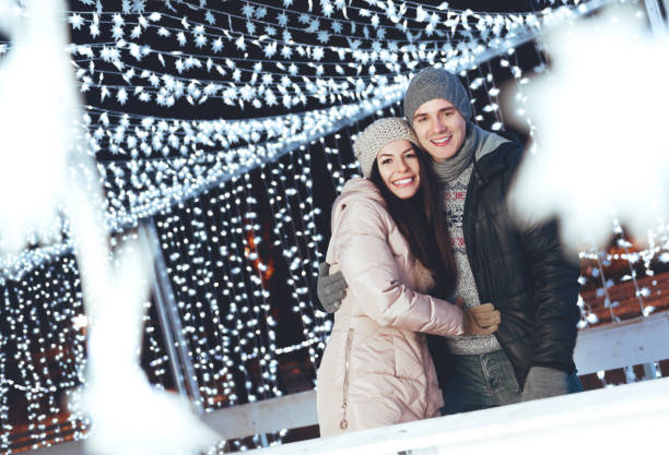 istock Young couple outdoors on a winter evening having fun 871510258