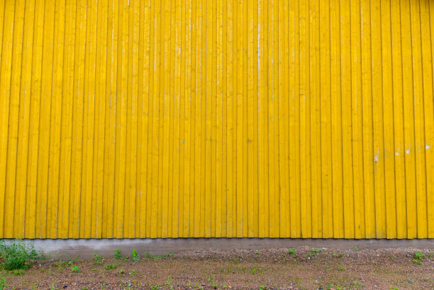 Portrait Of Yellow Corrugated Wall Of Metal