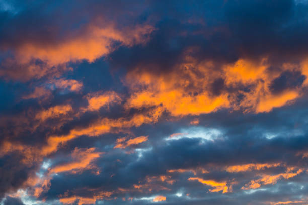 istock dramatic natural colorful orange sky cloudscape in dark 871513524