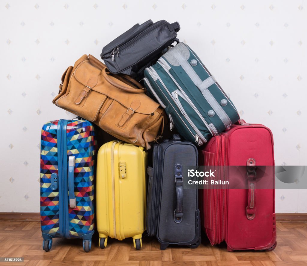A stack of old suitcases A stack of used suitcases Luggage Stock Photo