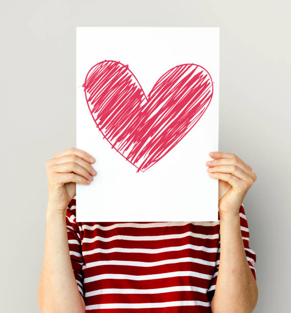 istock kid holding heart icon on a paper 871516826