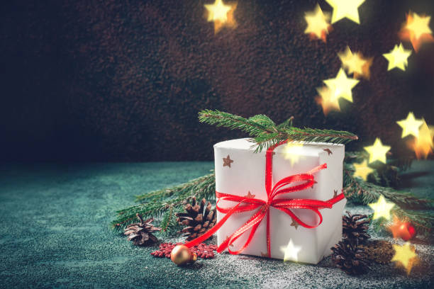 istock Christmas gift box festive decorated and conifers tree cones 871516930