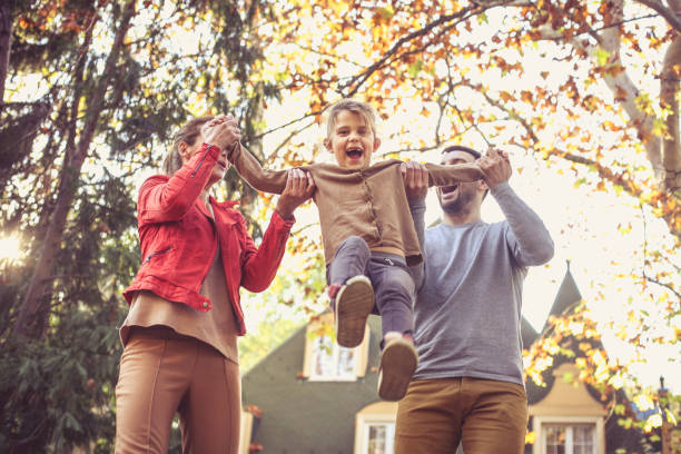 istock Mom and daddy make me to fly. On the move. 871517386