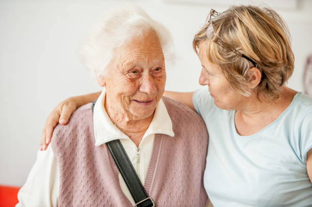 Tenderness Between Senior Mother And Mature Daughter