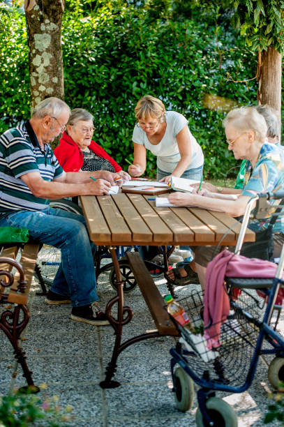 istock Group Theraphy When Seniors Can Draw And Color For Relaxation And To Maintain Hands Ability 871518374