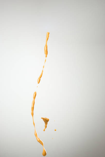 istock Cooking oil splash on gray background 871519696