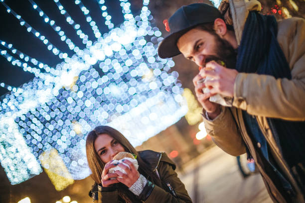 istock Man and woman eating burger 871524632