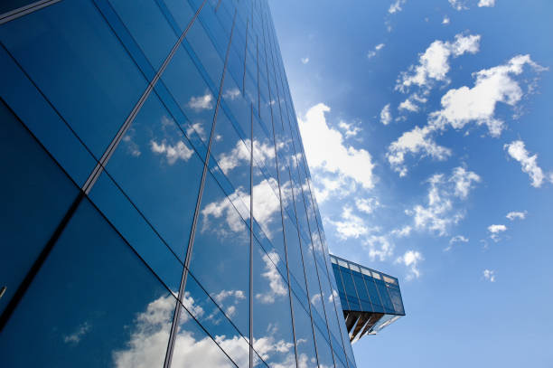 istock Business office building, clouds and sky in Barcelona, Spain 871524986