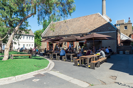 Melbourne, Australia - February 7, 2016: outdoor dining at one the food businesses at Abbotsford Convent in inner urban Melbourne.