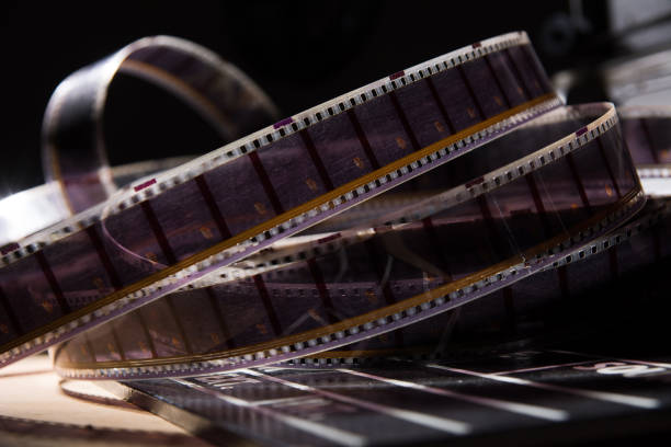istock Old film with a movie on a dark background 871529080