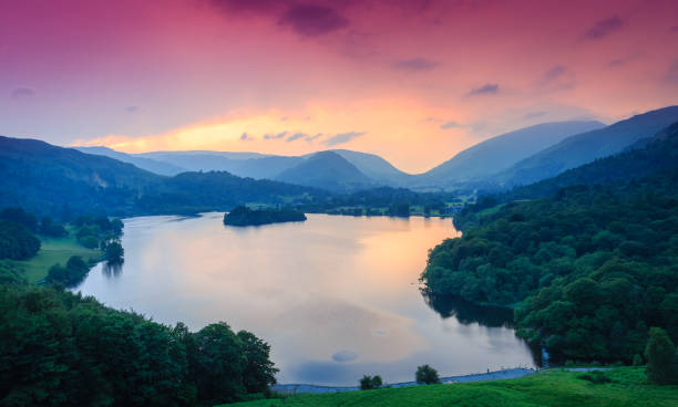 Fiery sky above Grasmere Fiery sky above Grasmere, The Lake District, Cumbria, England grasmere stock pictures, royalty-free photos & images