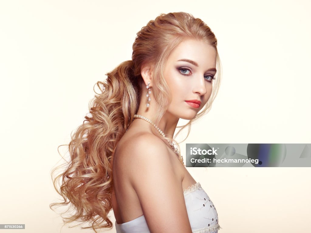 Blonde Girl With Long And Shiny Curly Hair Stock Photo - Download Image Now - Bride, Make-Up, Stage Make-Up - iStock Blonde Girl With Long And Shiny Curly Hair Stock Photo - Download Image Now - Bride, Make-Up, Stage Make-Up - iStock