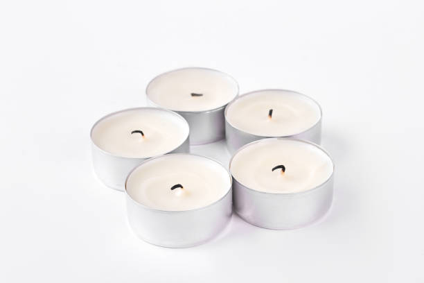 istock Set of five round tea light candles. 871536870