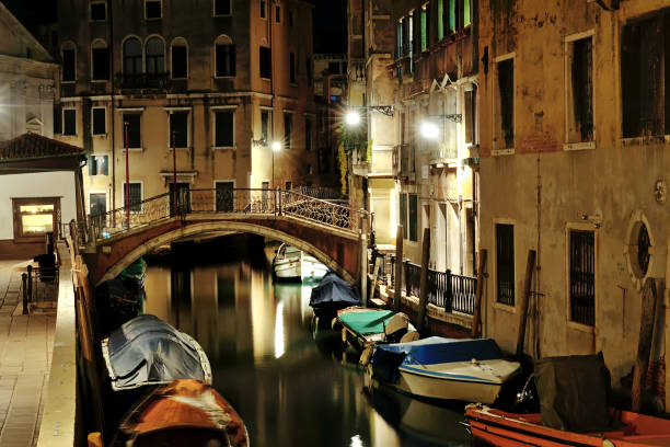 istock Venetian canal night view, Venice, Italy 871540588