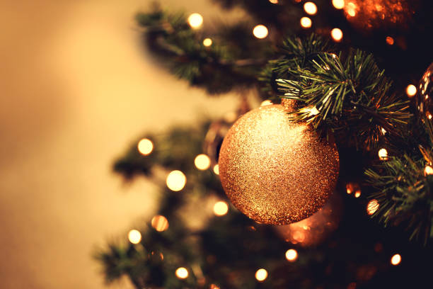 istock Fir branch with balls and festive lights 871540882