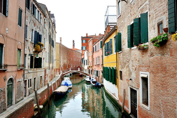 istock Picturesque canal in Venice, Italy 871543342