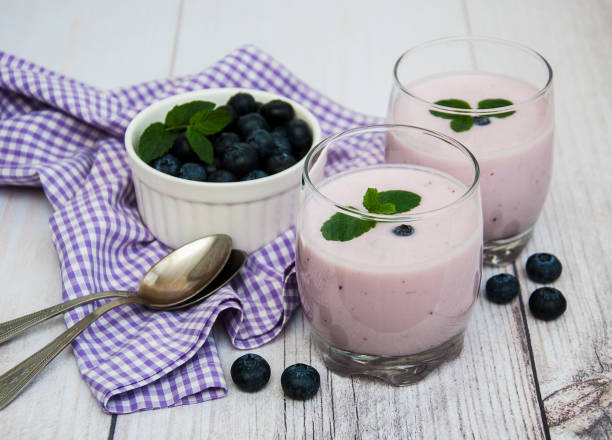 istock Glasses with blueberry yogurt on a table 871544802