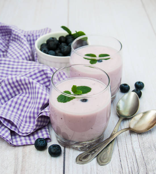istock Glasses with blueberry yogurt on a table 871544810