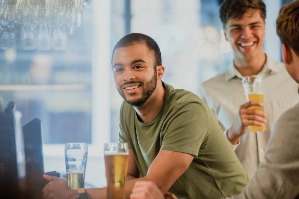 istock Men Buying Drinks At The Bar 871547242