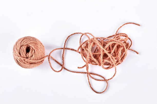 istock Ball of brown yarn on white background. 871553960