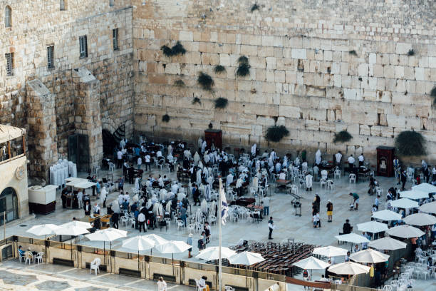 istock man  are praying in the western wall jerusalem. 871554382