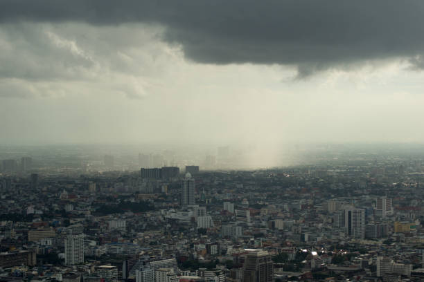 istock monsoon thunderstorm over bangkok - misty sky 871557540