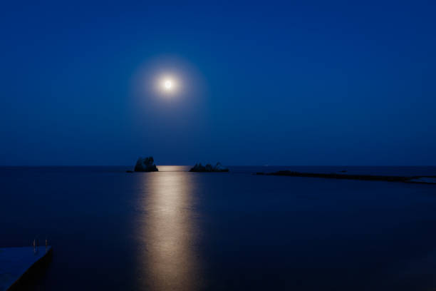istock moon, sea and rocks 871558620