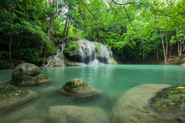 istock Breathtaking green waterfall at deep forest, Erawan waterfall located Kanchanaburi Province, Thailand 871559014