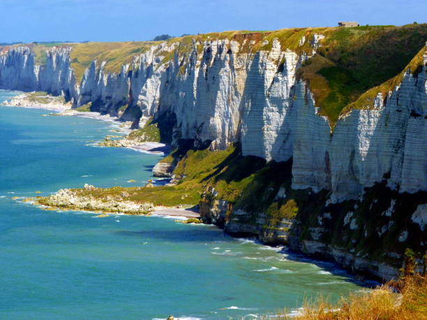 istock Chalk cliffs and stony coastline in Normandy, France. 871563802