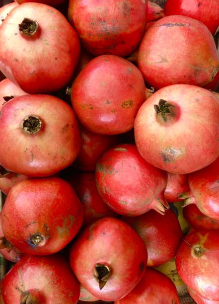 istock Pile of red pomegranates 871564586