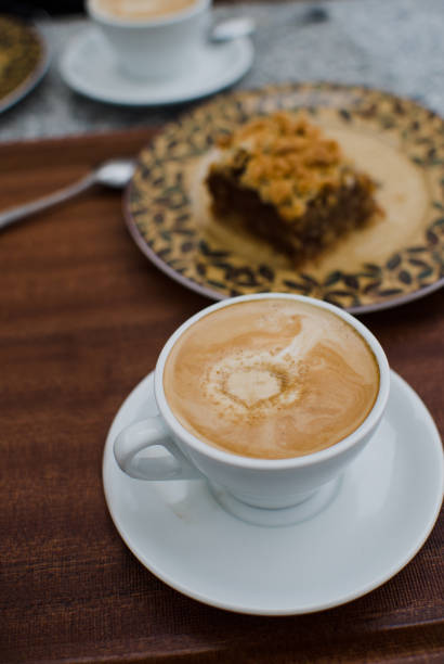 istock close up on coffee with Apple cake on background 871565322