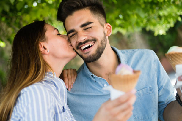 istock Happy couple having date and eating ice cream 871565758