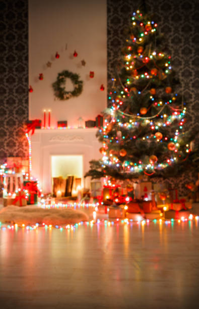 istock Christmas room interior design, decorated tree in garland lights 871566576