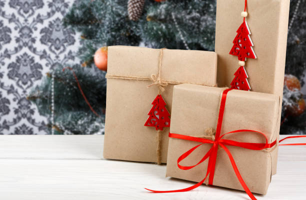 istock Christmas presents on decorated tree background, holiday concept 871568852