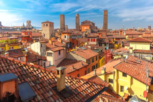 Aerial view of Bologna Cathedral and towers towering above of the roofs of Old Town in medieval city Bologna in the sunny day, Emilia-Romagna, Italy
