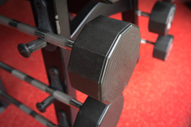 istock Rod and weights in the gym 871569120